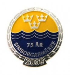 Simmärket simborgarmärket 2009 är gul och blått. Samla simborgarmärken eftersom dom byter färg varje år.