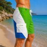 Sommargröna badshorts för herr från Oxide i längre surfmodell med blå och vita detaljer. Shortsen har snörning i midjan, en kard