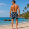 Långa svarta badshorts i herrmodell med roligt glasögonmönster och innerbyxa.