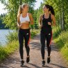 Svarta rosa löpartights för dam under löpning utomhus – Victoria Dronsfield