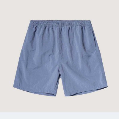 Badshorts med snöre och resår i midjan. Snabbtorkande material.